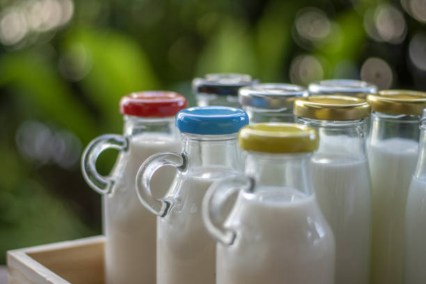bottles with fresh milk in a box.