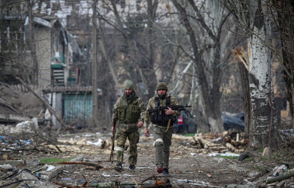 service members from chechen republic walk during fighting in ukraine russia conflict in mariupol