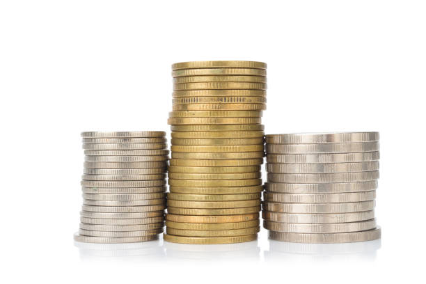 silver and glod coin stack. town. pile. isolated on white background.
