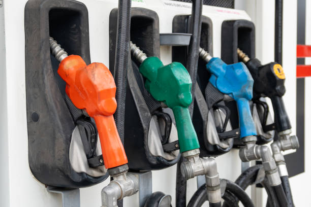 colorful petrol pump filling nozzles, gas station in a service. industry