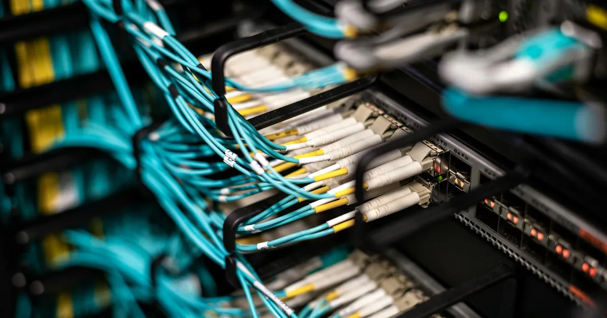 Numerous wires and cables mounted into server patch panel in modern data center