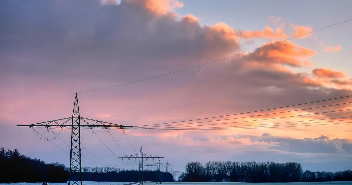 field, high voltage pylons, overhead lines