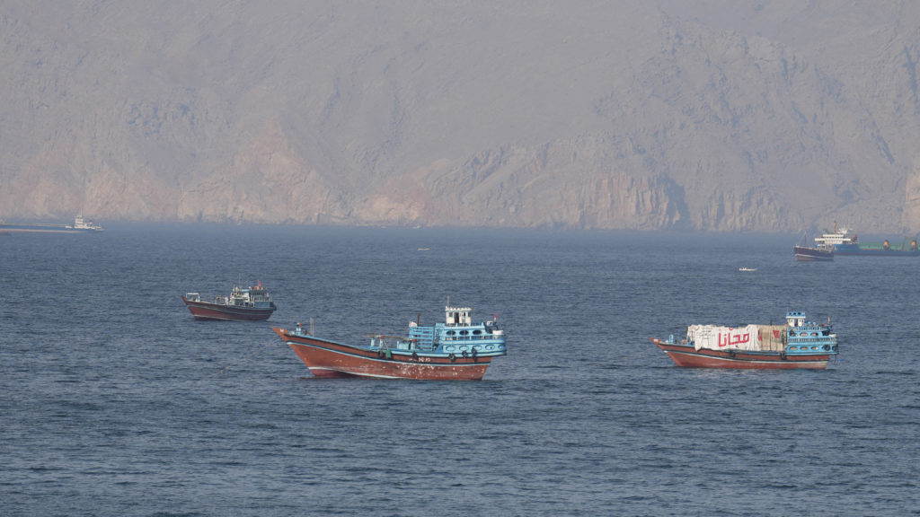 ships and tankers in the strait of hormuz off the coast of musandam