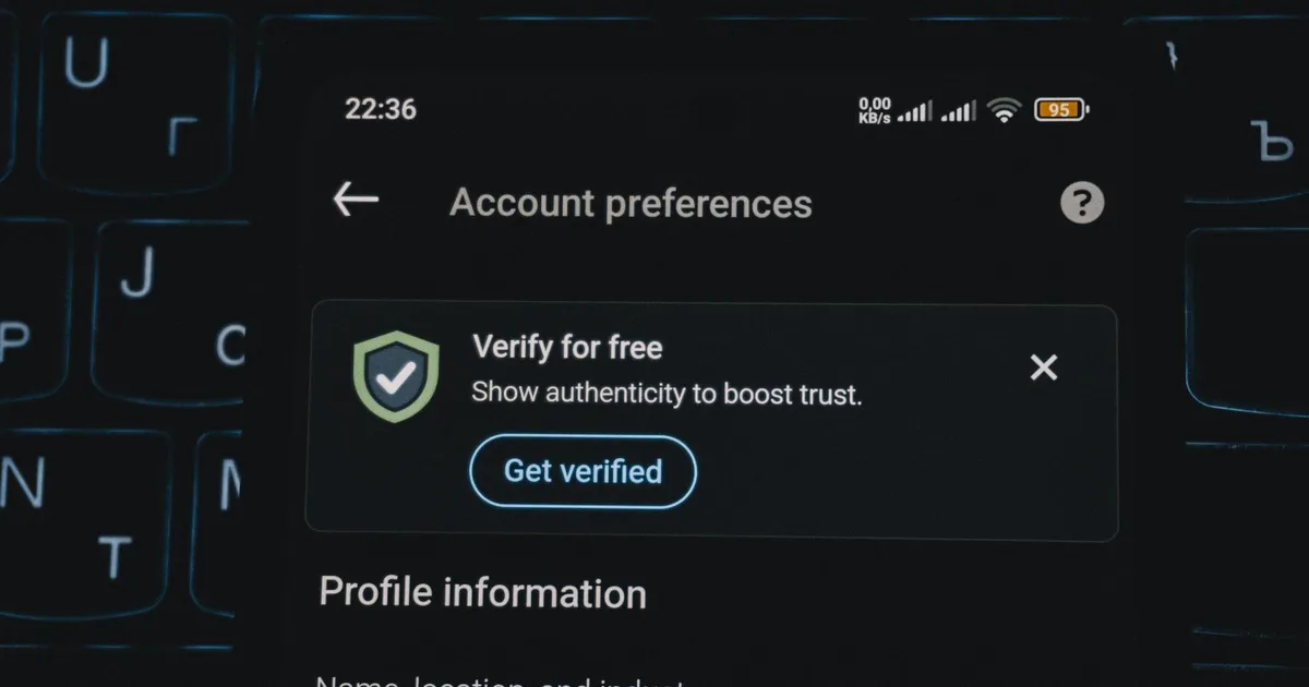 Close-up of a smartphone screen displaying account verification alert. Ideal for security and authenticity themes.