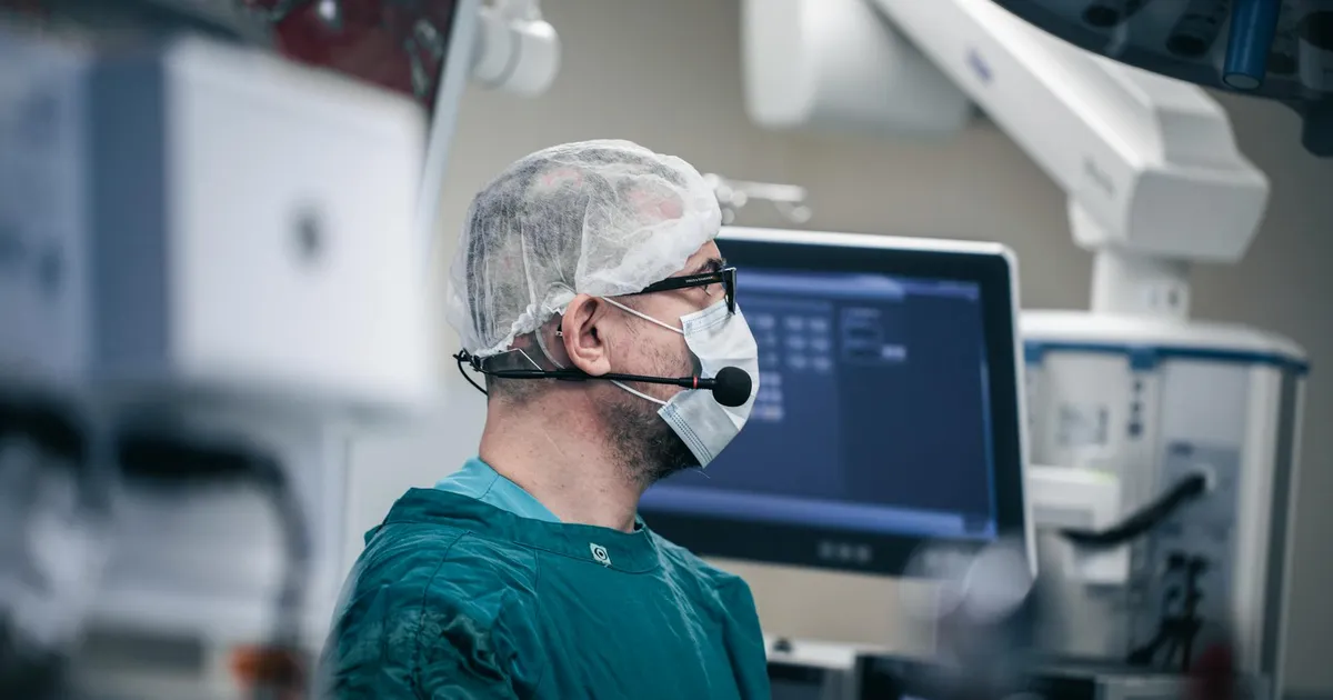 Surgeon in advanced operating room with surgical equipment in Baku, Azerbaijan.