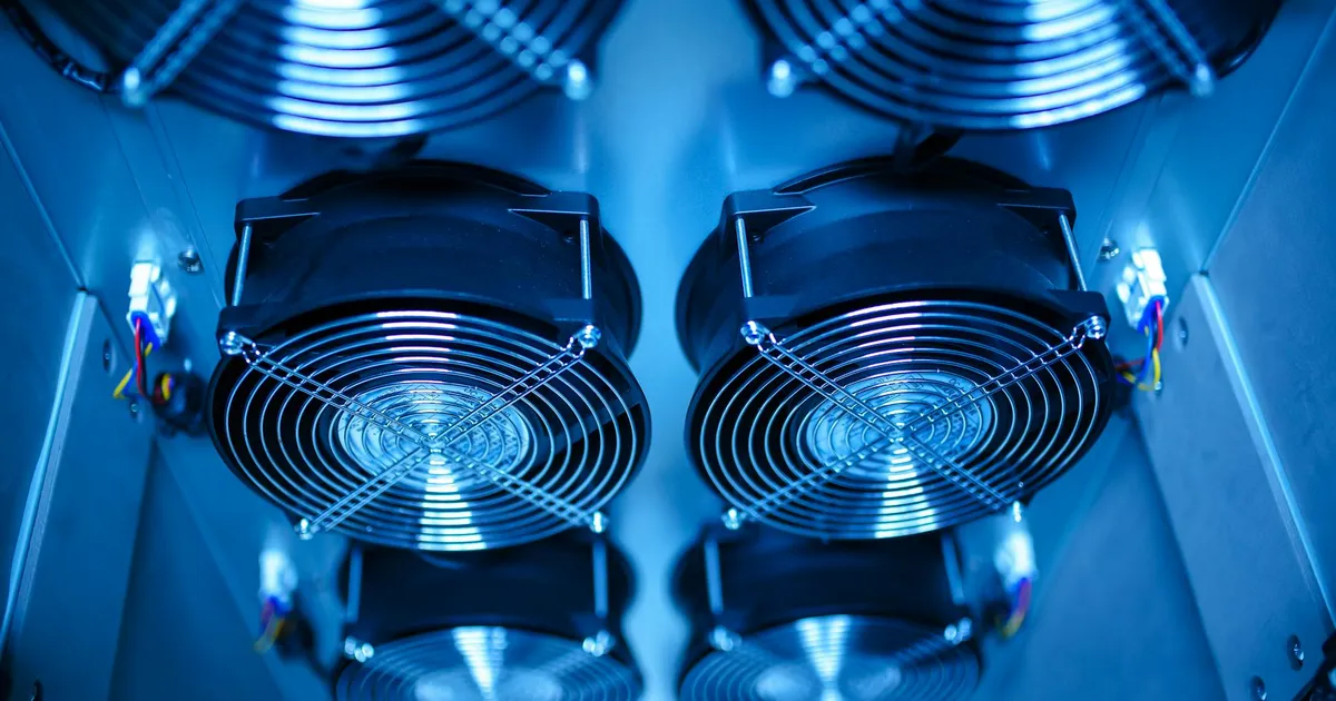 Close-up of cooling fans in a server room, showcasing technology and efficiency.