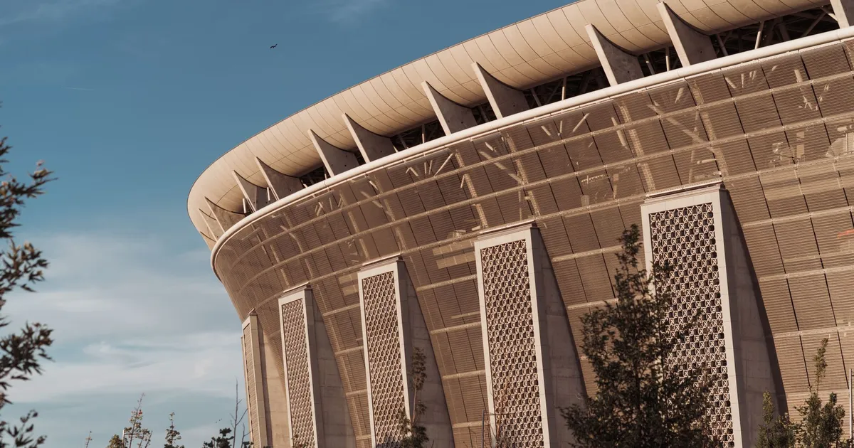 A close-up of Ferenc Puskás Stadium's architecture in Budapest, captured on a sunny day.