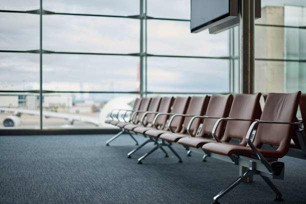 empty airport with blurred plane and cloudy tragik sky on a background
