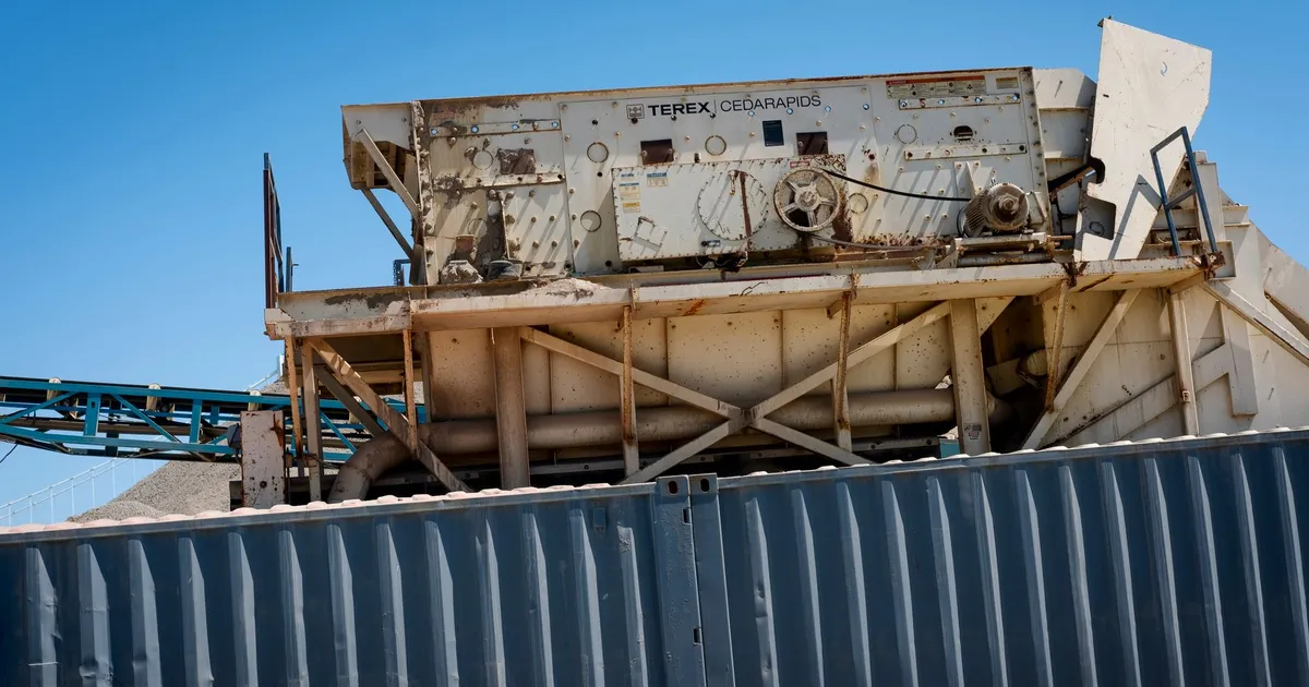 Close-up of large machinery under a clear blue sky, ideal for industrial themes.