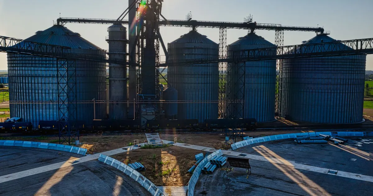 Aerial view of large industrial silos with the sun shining brightly in Randolph, MN.