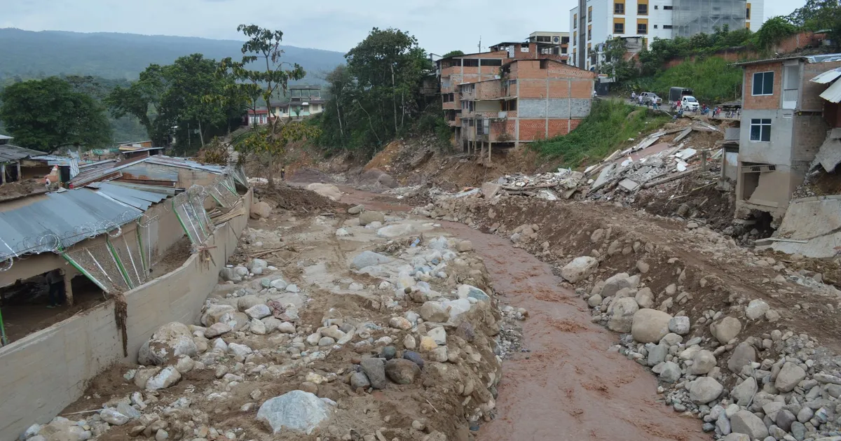 Destruction in Mocoa, Colombia due to a severe mudslide with debris and damaged buildings.