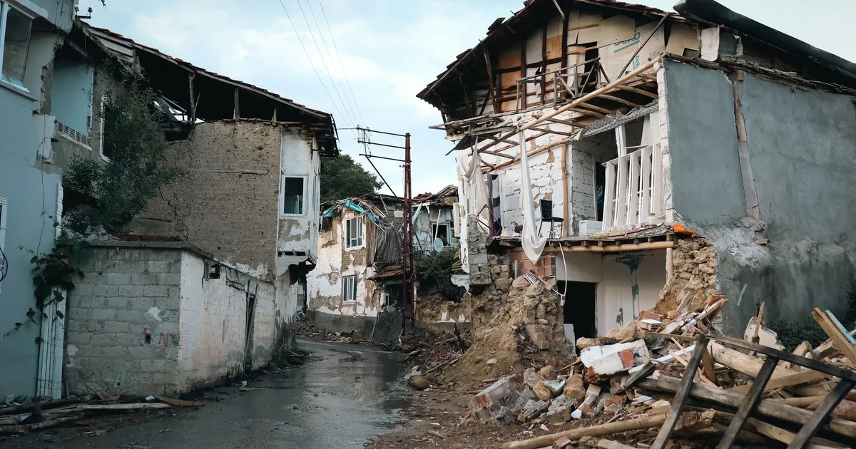 Destroyed buildings in an urban area after an earthquake.