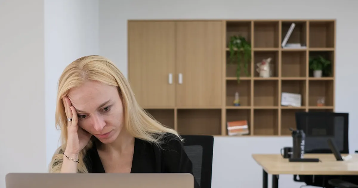 Disappointed Woman Working on Laptop