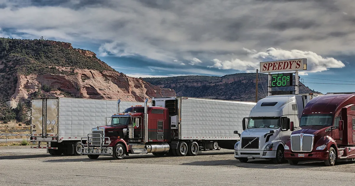 Semi Truck and Trailers at a Gas Station Entering the Mountains of New Mexico