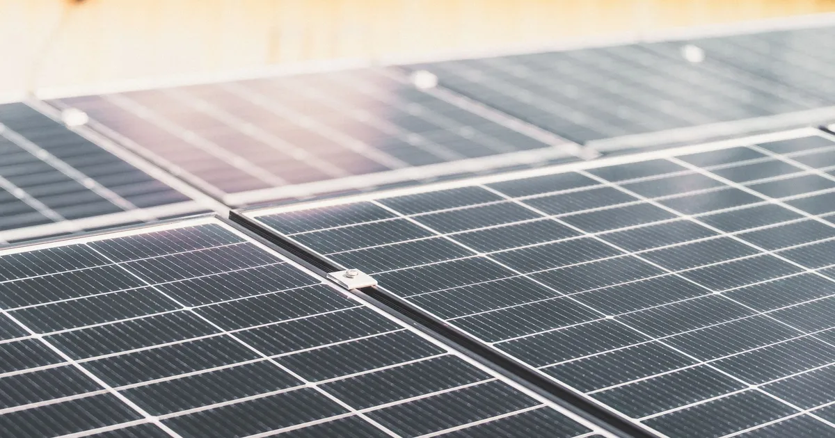 Detailed view of a rooftop solar panel array capturing sunlight for renewable energy production.