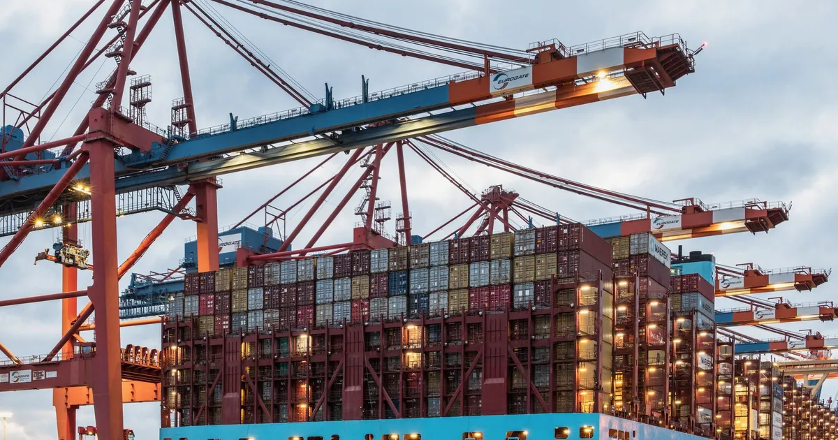 A cargo ship loaded with containers at Hamburg's bustling commercial dock.