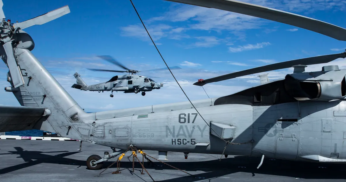 Sikorsky MH-60R 'Sea Hawk' or 'Seahawk' (MH-60S is shown above the BuNo 168558)