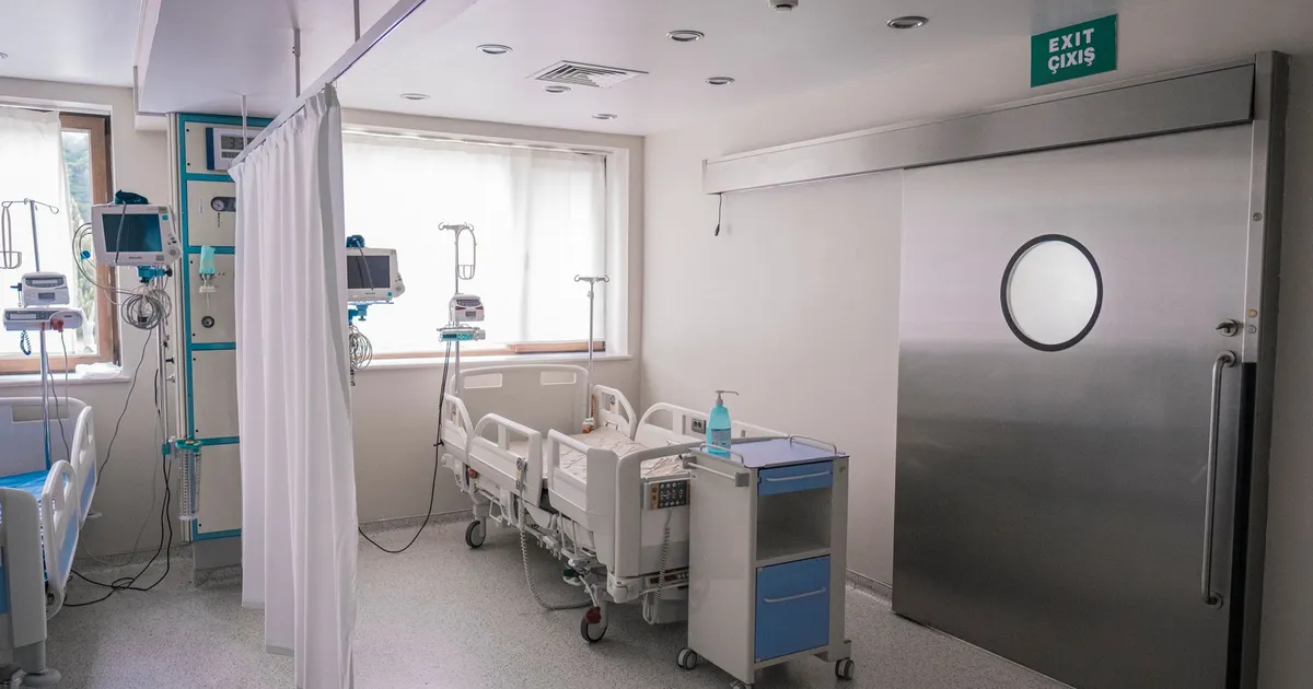 Spacious hospital room in Baku featuring medical beds and equipment.