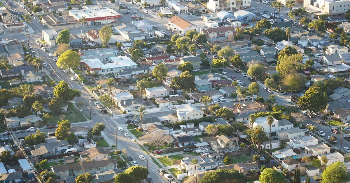 Overhead shot of a suburban neighborhood in Ventura, showcasing homes and streets.