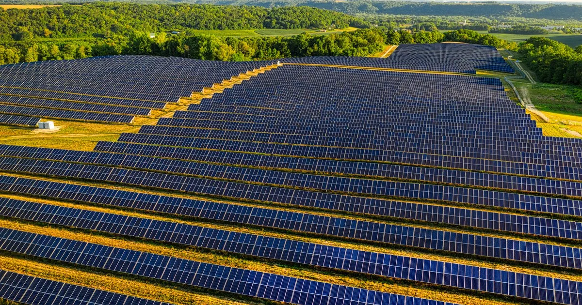 Aerial view of a vast solar farm in Red Wing, MN, generating renewable energy.