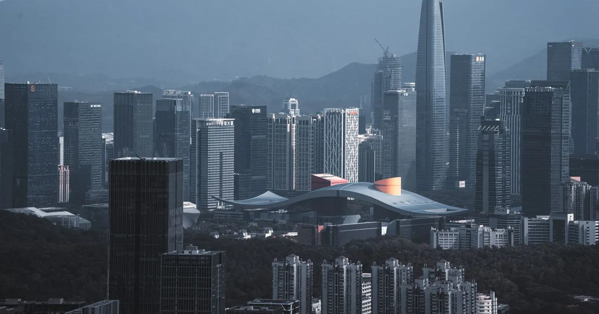 Stunning aerial view of Shenzhen's modern skyline with iconic skyscrapers at dusk.