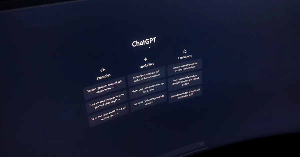Close-up of a computer screen displaying ChatGPT interface in a dark setting.