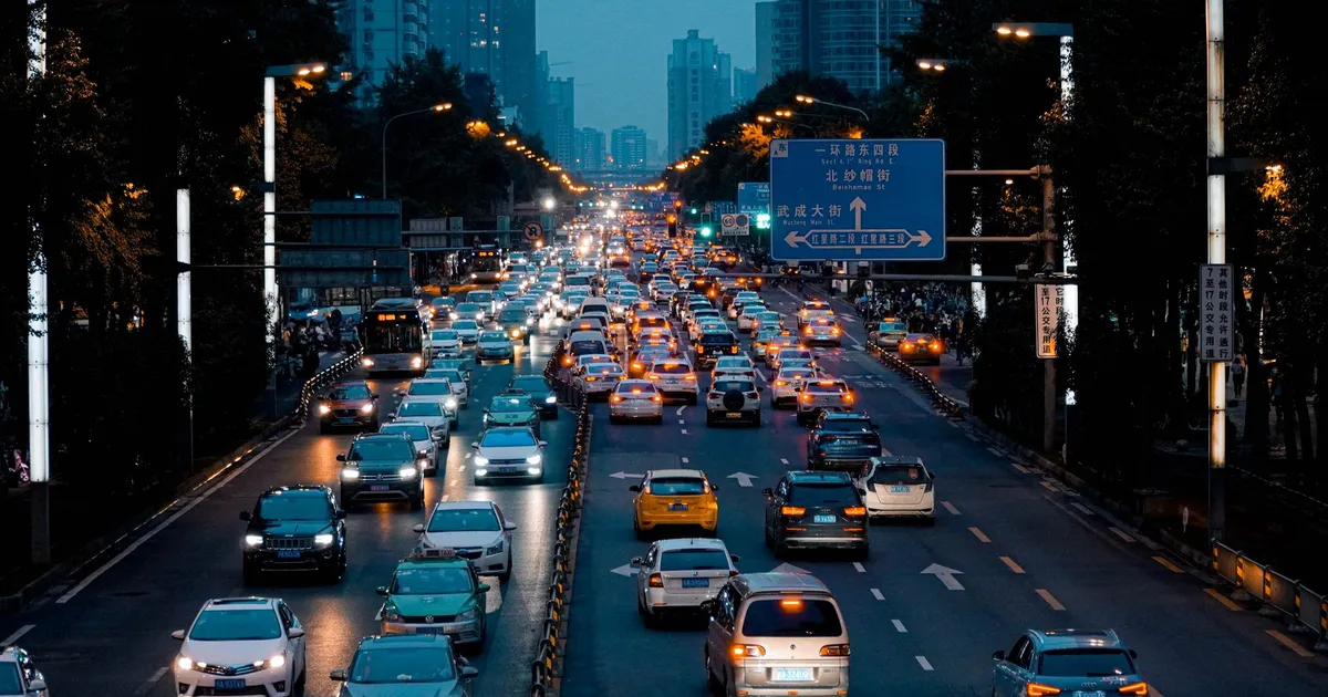 Evening traffic in downtown Chengdu showcasing vibrant urban life in Sichuan, China.
