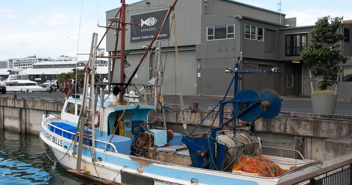 Fishing vessel in front of restaurant
